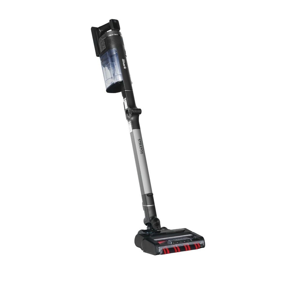 A cordless stick vacuum cleaner with a transparent dust bin, gray and black handle, and a black floor head with red accents, shown on a plain white background.